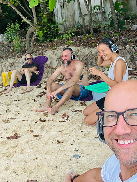 Group enjoying a relaxing time on a beach as part of a detox program